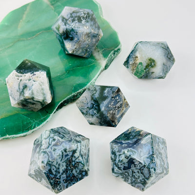multiple Moss Agate Geometric Shapes displayed to show the differences in the sizes and color shades 