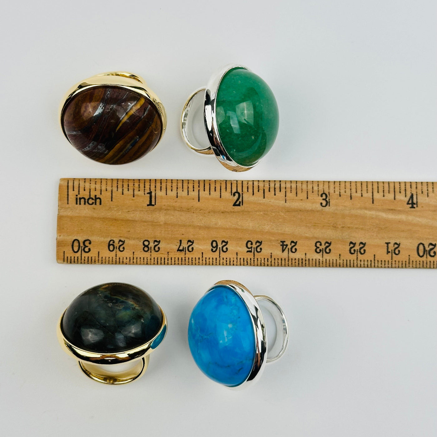 rings next to a ruler for size reference 