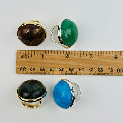 rings next to a ruler for size reference 