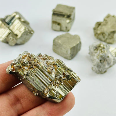 Pyrite Cluster in hand for size reference 