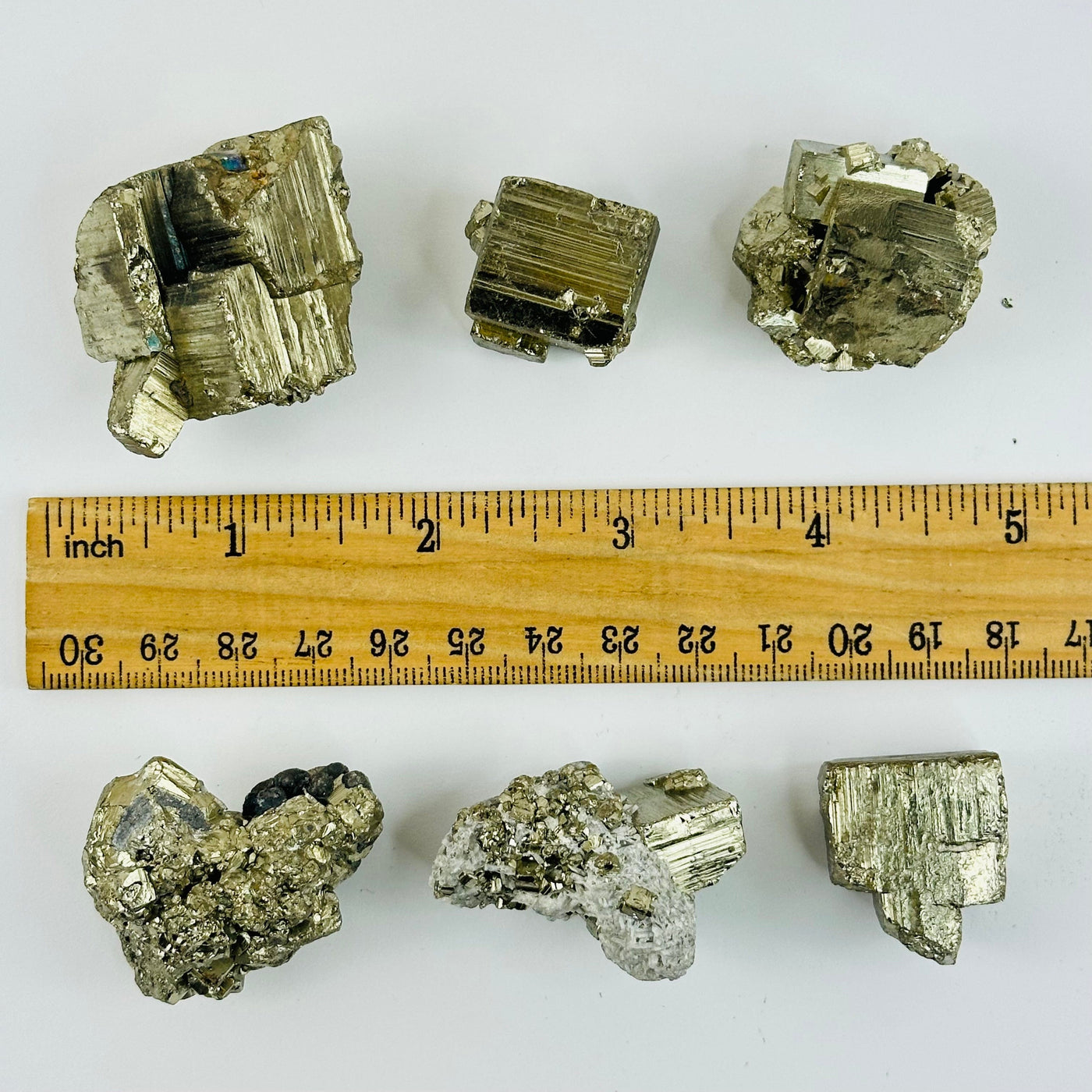 Pyrite Clusters - Natural Stones - next to a ruler for size reference 