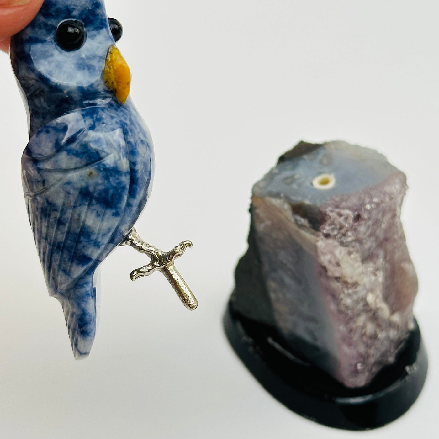 the crystal owl comes off the amethyst base 