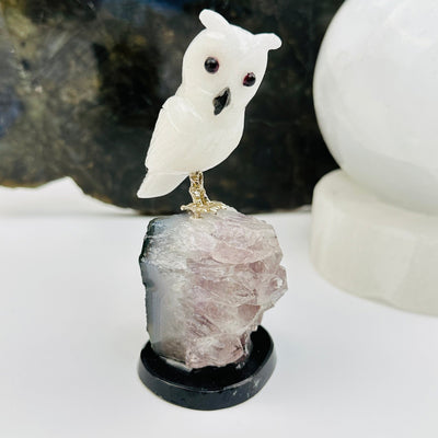 milk quartz owl on amethyst crystal base displayed as home decor 