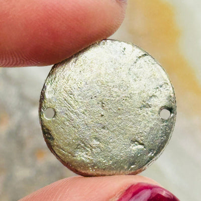 close up of the details on this silver toned brass charm connector 