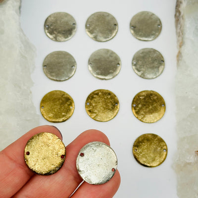 brass disk charms in hand for size reference 