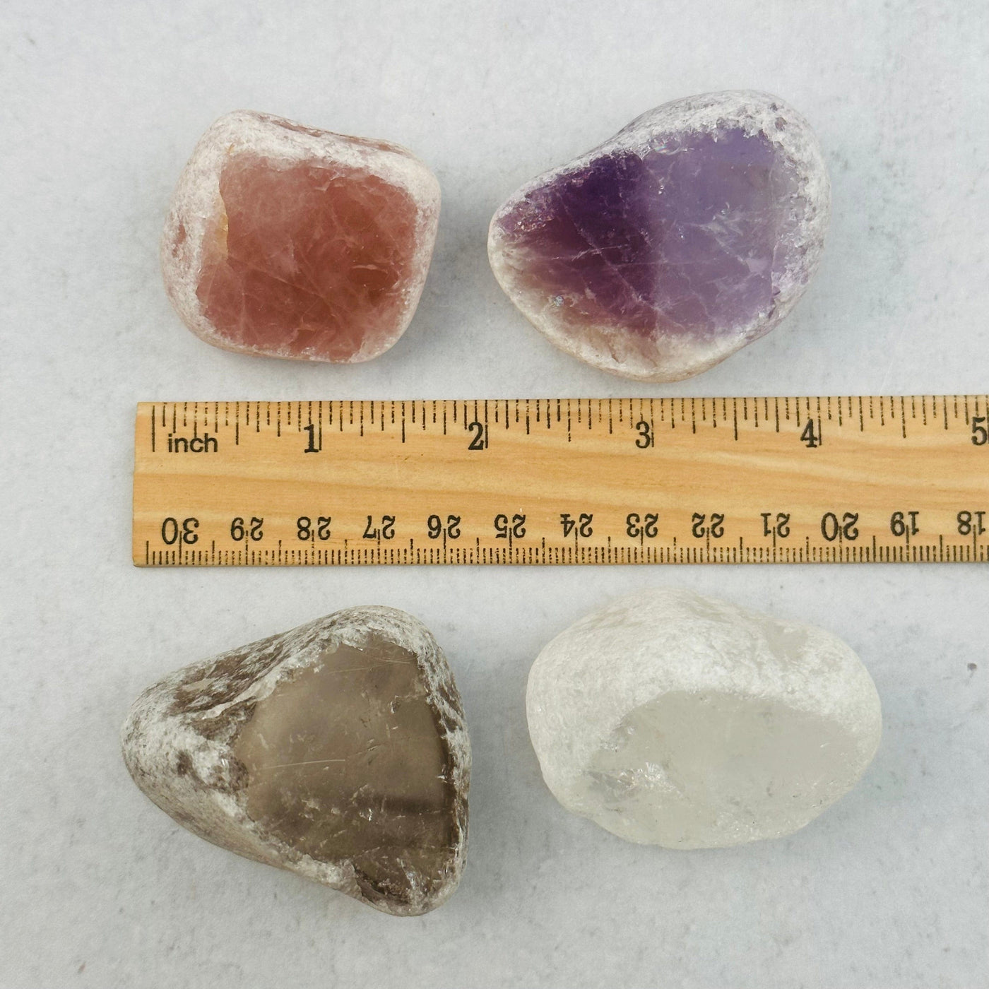 seer stones next to a ruler for size reference 