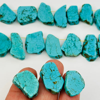 close up of the details on these turquoise crystal beads 