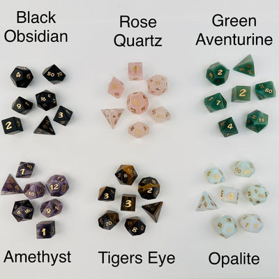 crystal dice sets displayed next to their gemstone name