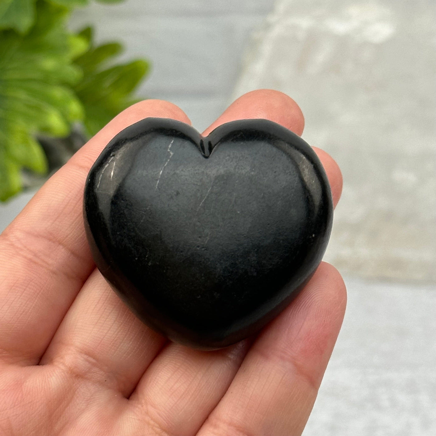 close up of the details on this shungite heart 
