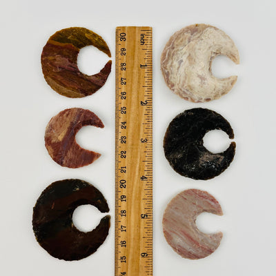 jasper moon crescents displayed next to a ruler for size reference 