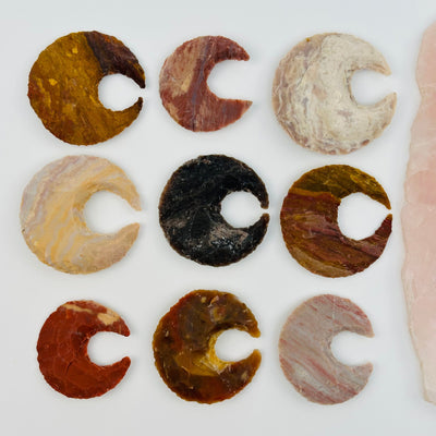 multiple moon crescents displayed to show the differences in the sizes and color shades 