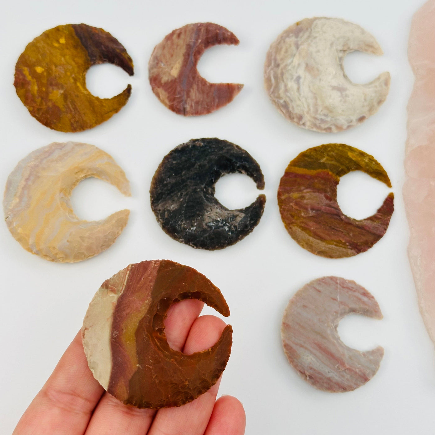 raw jasper moon crescent in hand for size reference 