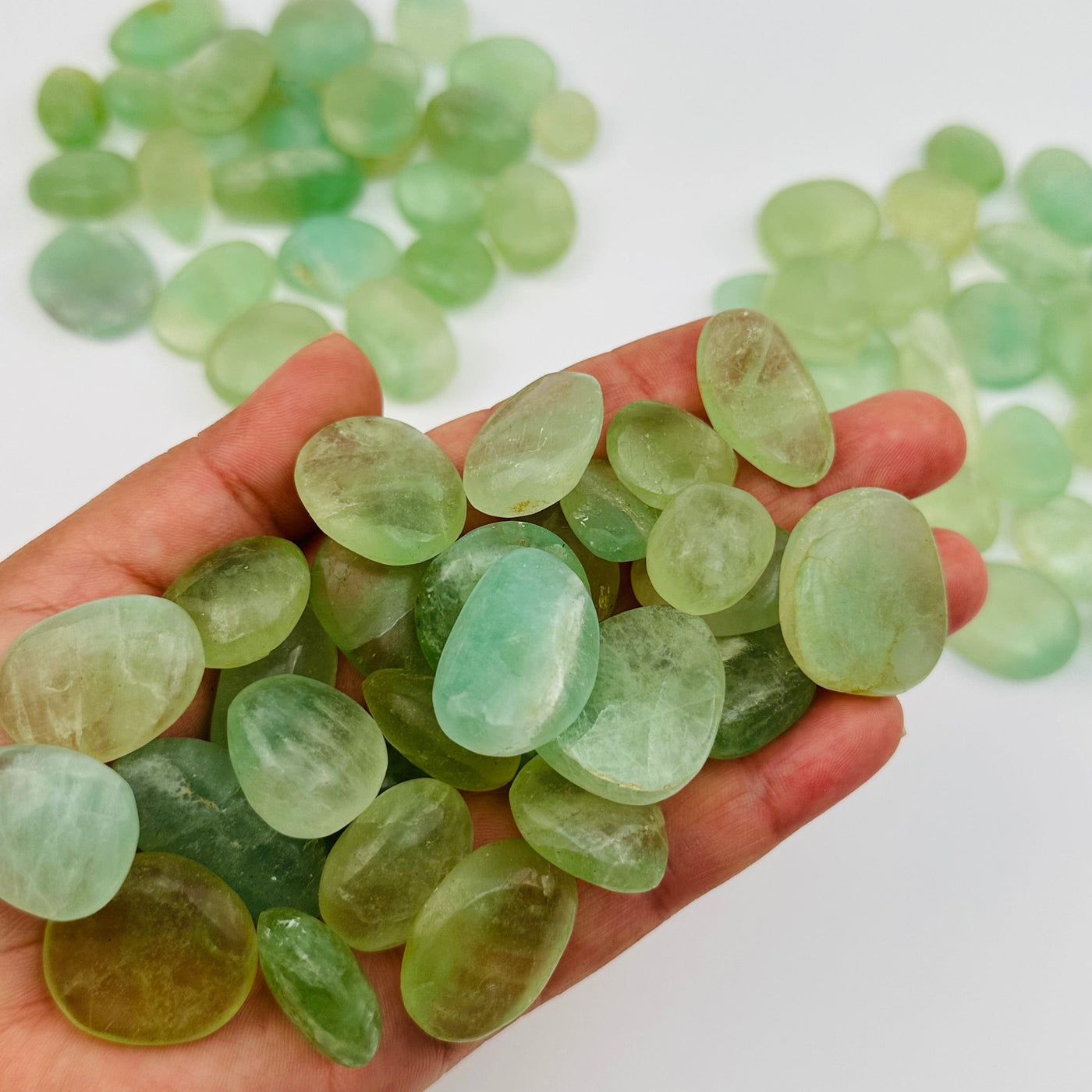 tumbled stones in hand for size reference 