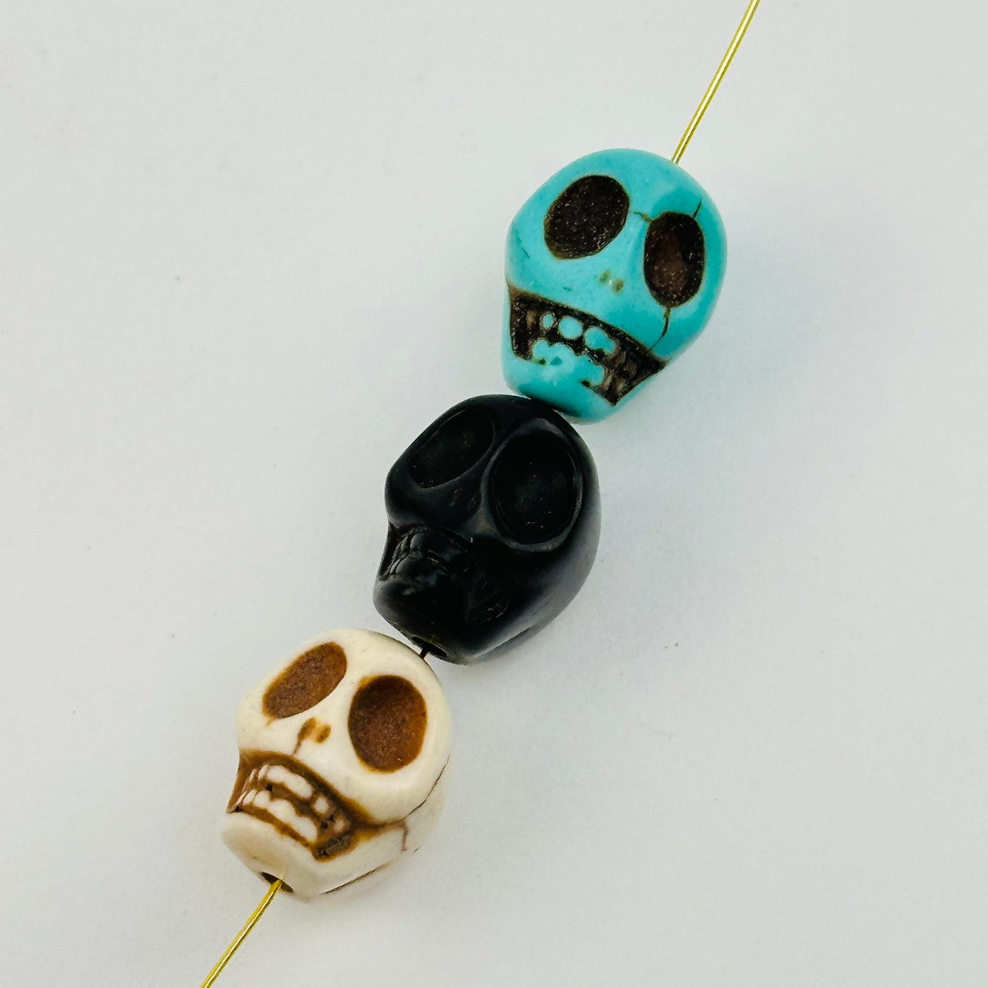 close up of the details on these skull beads 