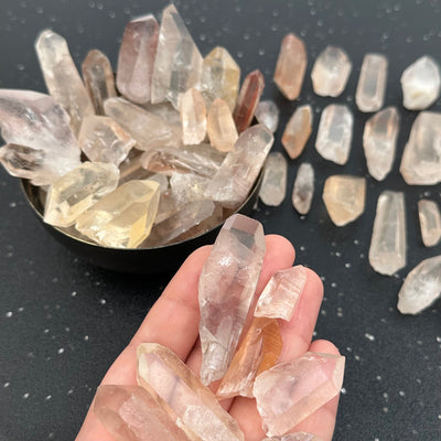 Lemurian Tangerine Crystal Points in hand for size reference 