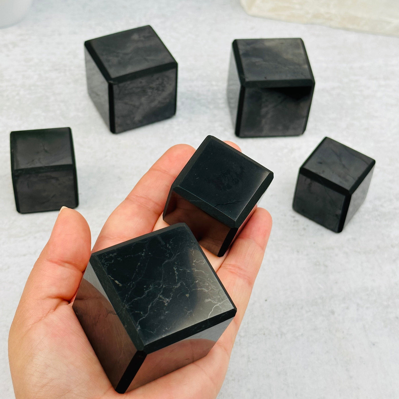 Shungite Cubes - 3cm or 4cm - in hand for size reference 