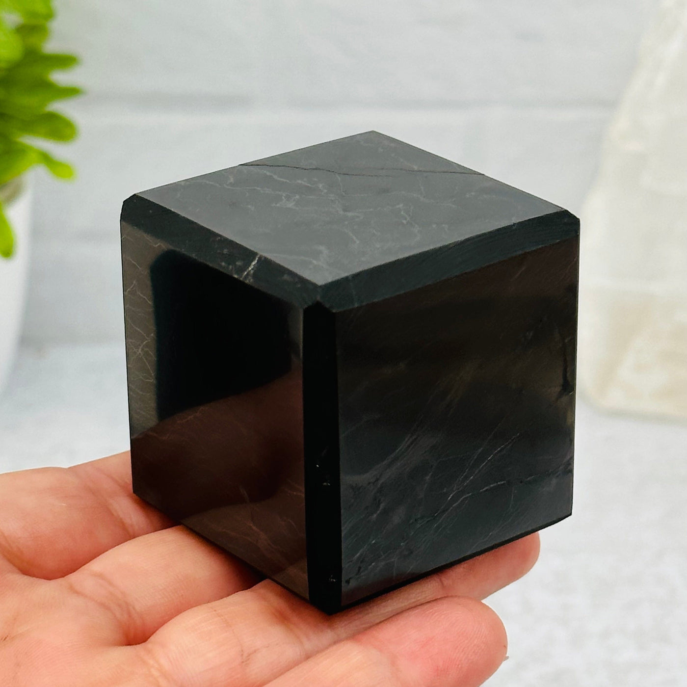 4cm shungite cube in hand for size reference 