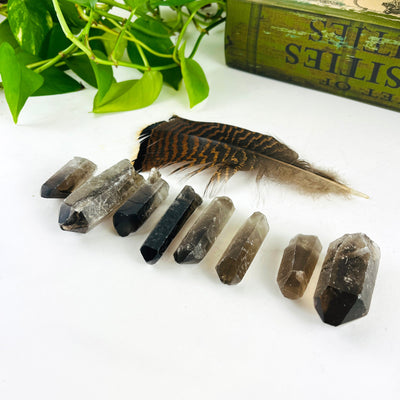 8 Raw Smoky Quartz Crystal Point Pendants showing side view of thickness