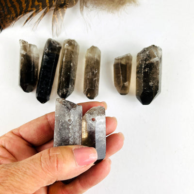 8 Raw Smoky Quartz Crystal Point Pendants WITH 2 IN A HAND SHOWING DRILL hole