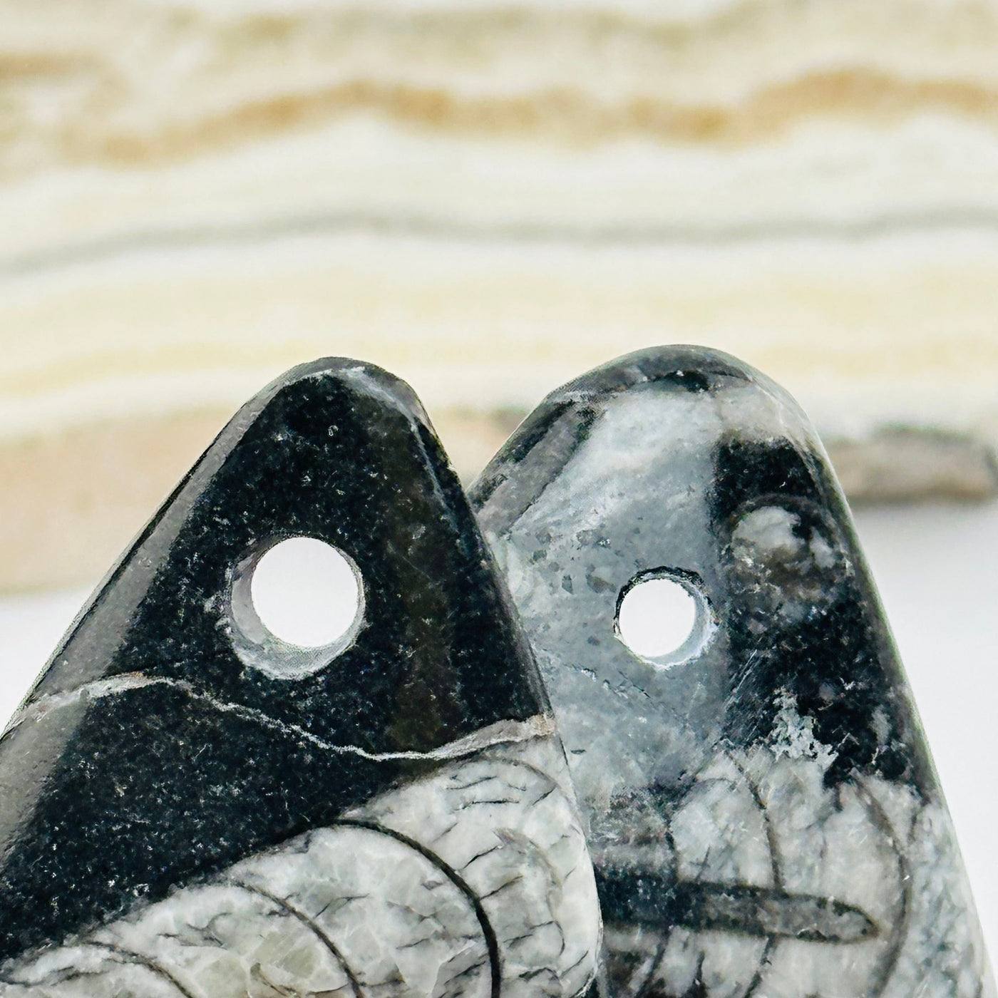 close up of the drilled holes on these beads