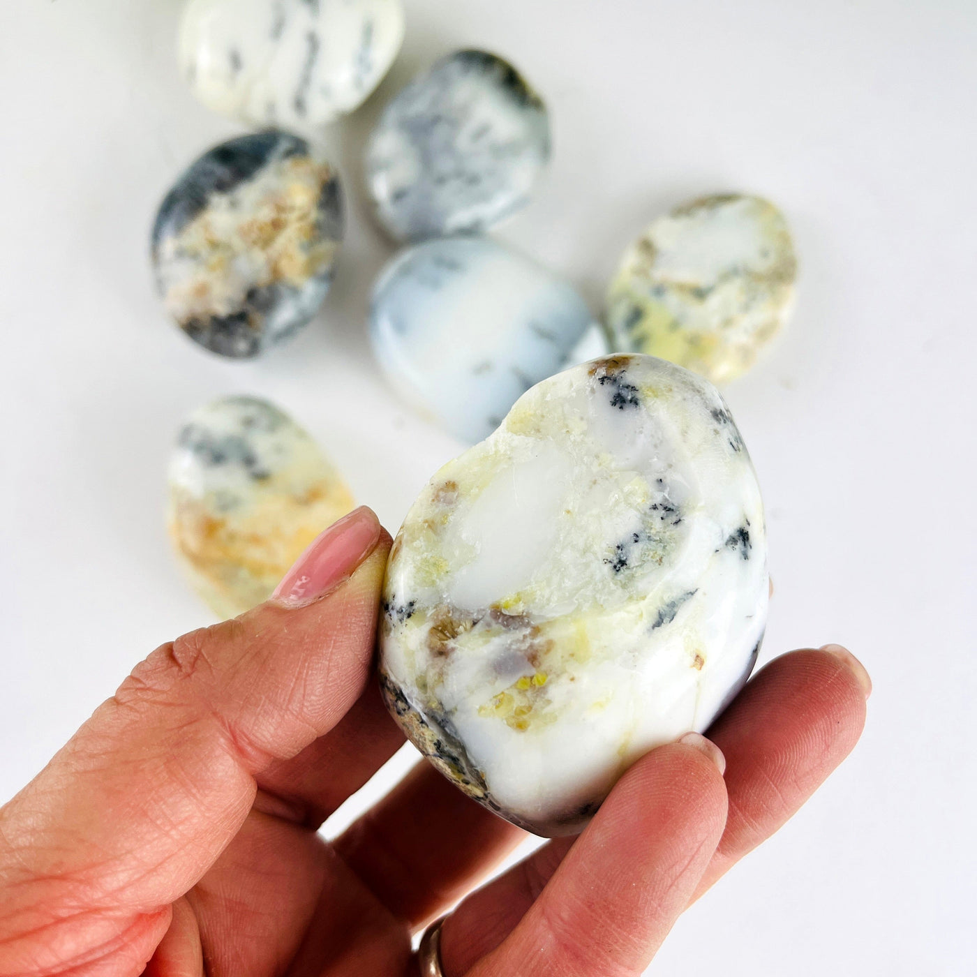 7Dendritic Opal Crystal Polished Palm Stones with 1 up close of the chipped stone