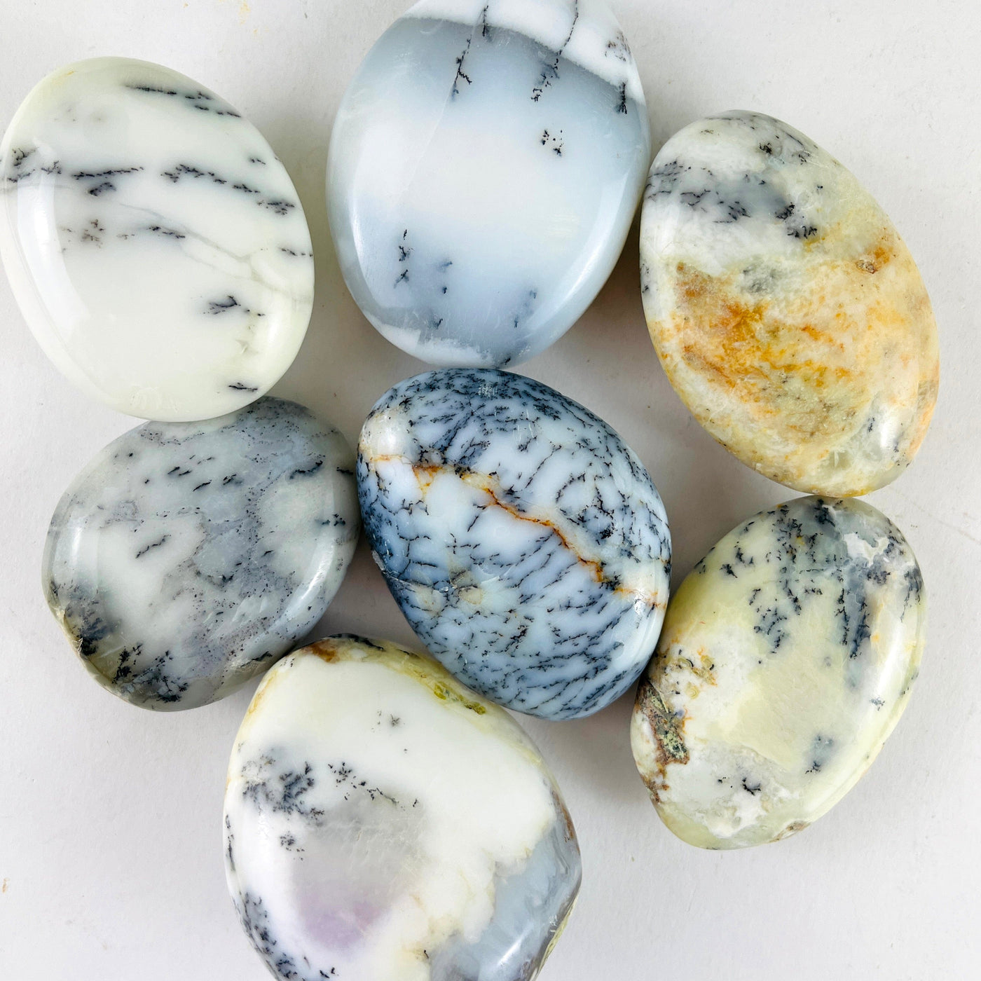 7 Dendritic Opal Crystal Polished Palm Stones up close