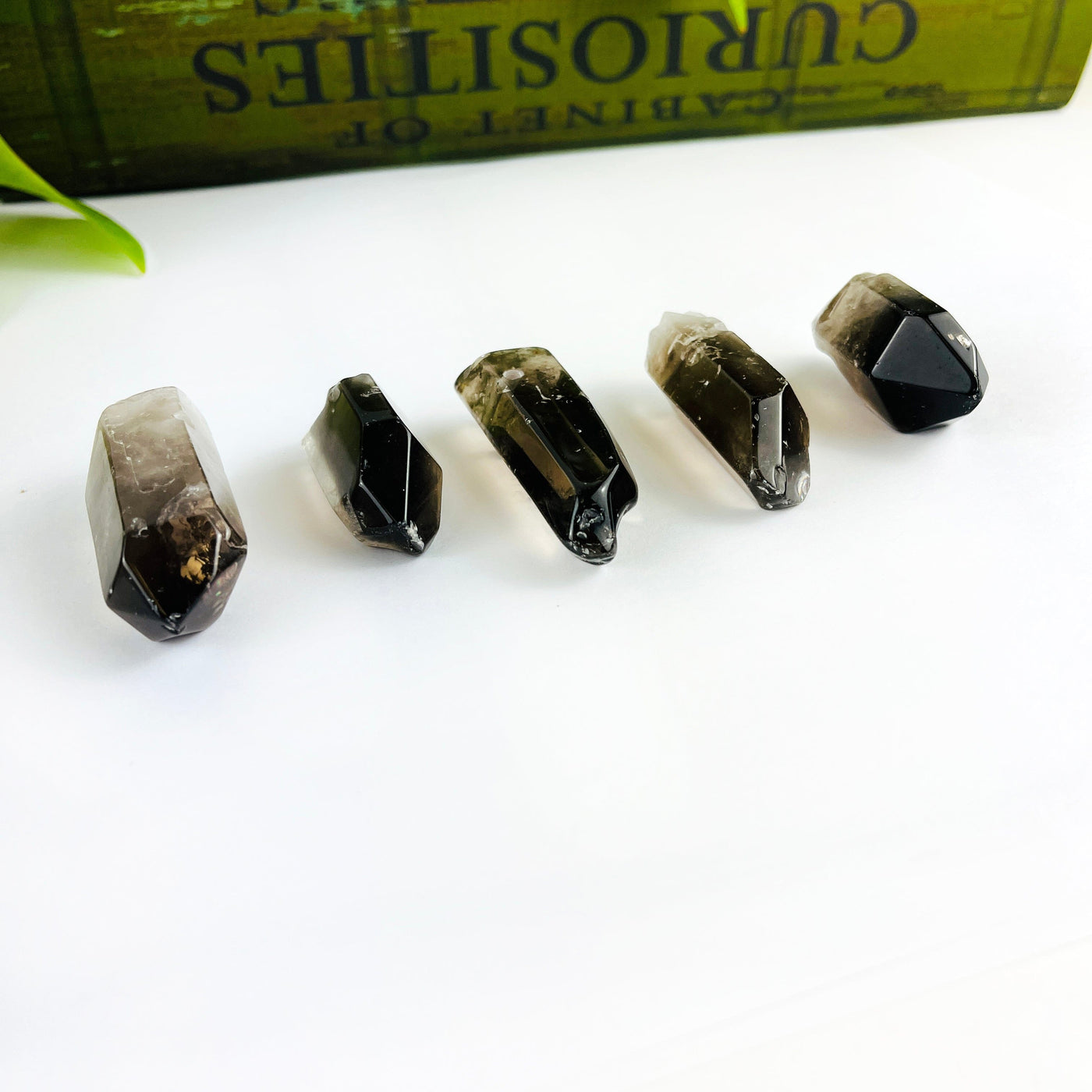 Jumbo Smoky Quartz Crystal Polished Point Drilled Pendants from a side angle showing thicknesses