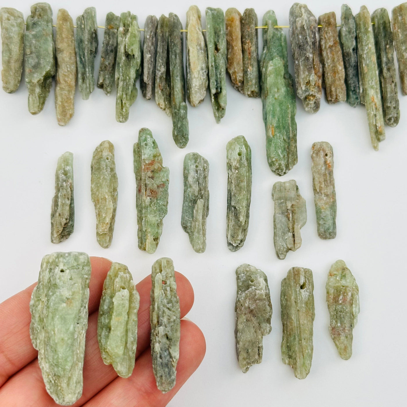 Green Kyanite Free Form Crystal Beads in hand for size reference 
