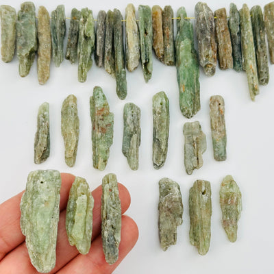 Green Kyanite Free Form Crystal Beads in hand for size reference 