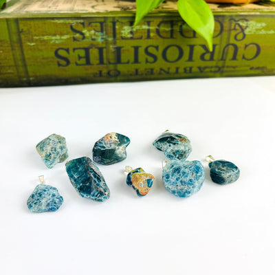 Apatite Polished Freeform Crystal Pendants with Silver Bails from a side angle