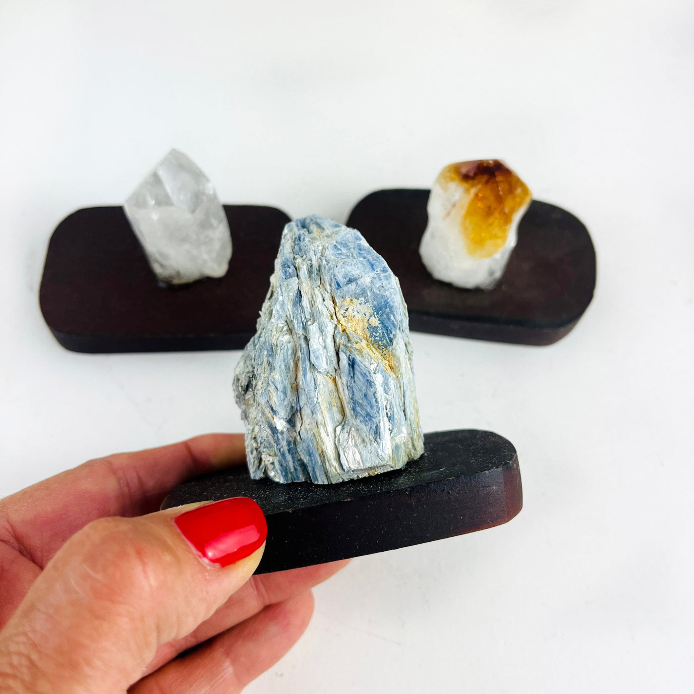 Crystals on Wood Base, showing up close on the blue kyanite one