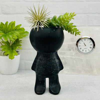 Carved Gemstone Plant Person displayed as home decor 