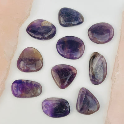 multiple beads displayed to show the differences in the sizes and color  shades 