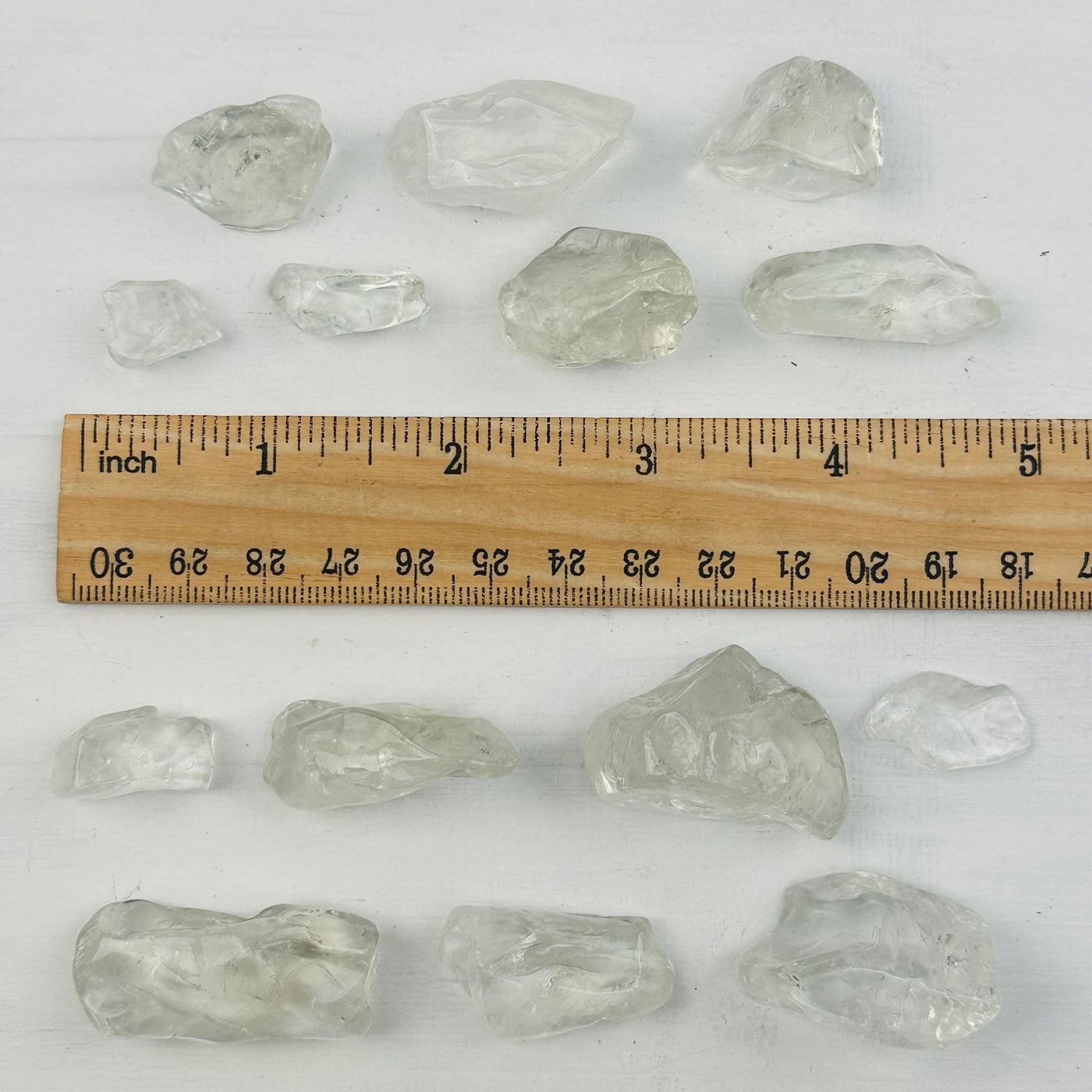 Prasiolite Polished Pieces next to a ruler for size reference 