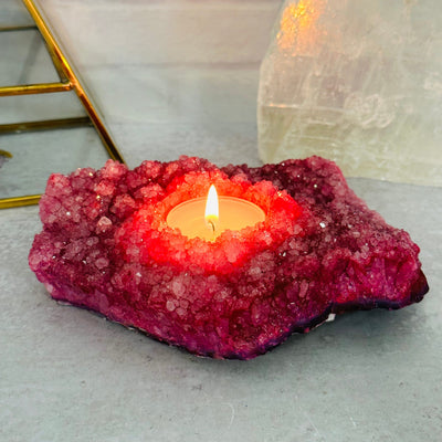 pink dyed candle holder displayed as home decor 