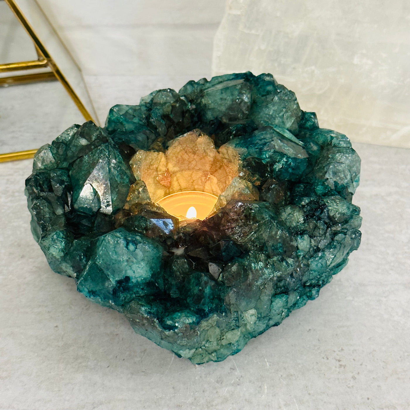 teal dyed candle holder displayed as home decor 