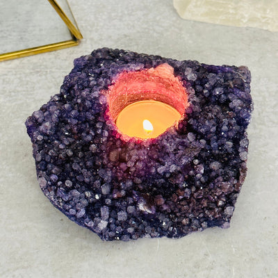 purple dyed candle holder displayed as home decor 