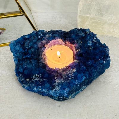 blue dyed candle holder displayed as home decor 