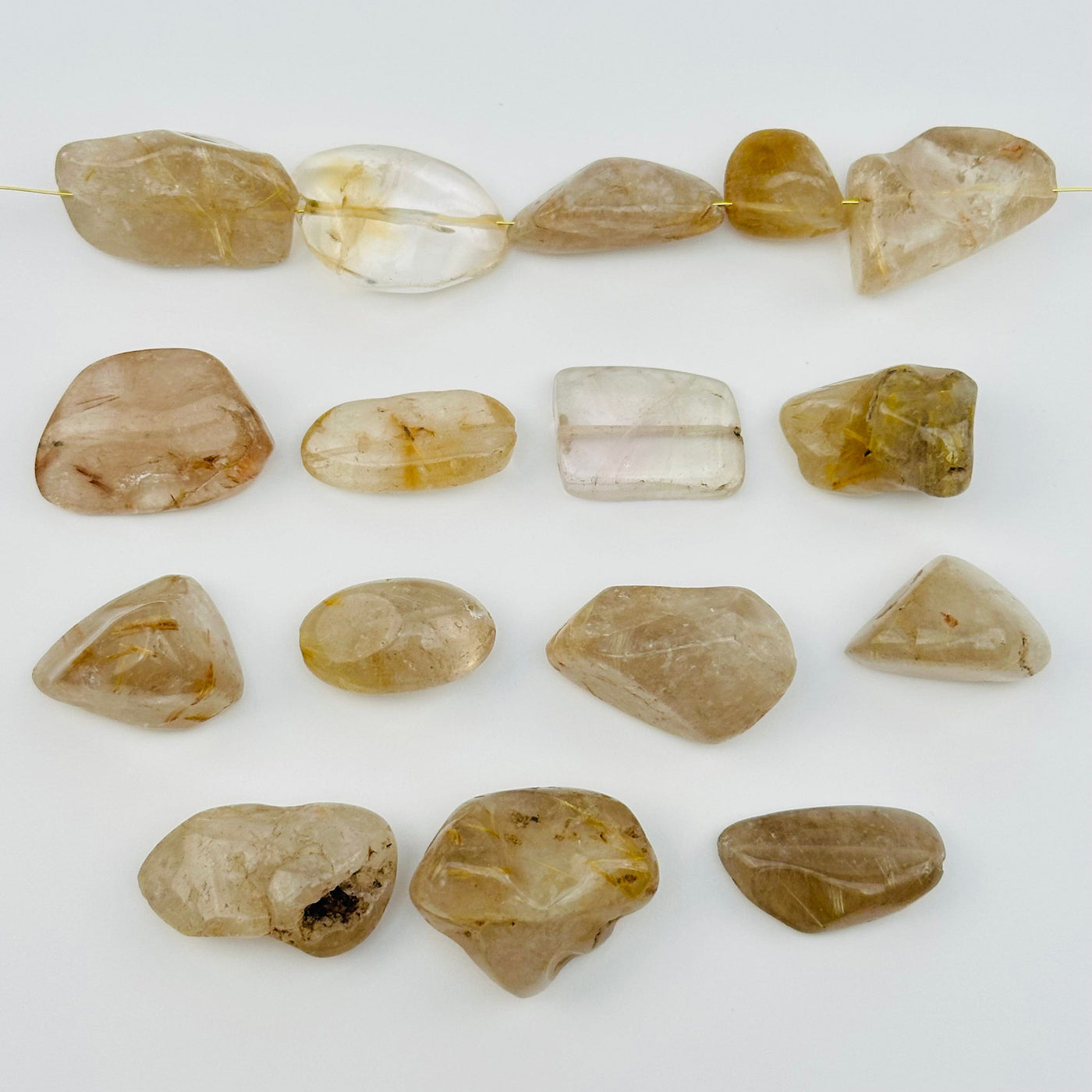 multiple beads displayed to show the differences in the sizes and color shades 