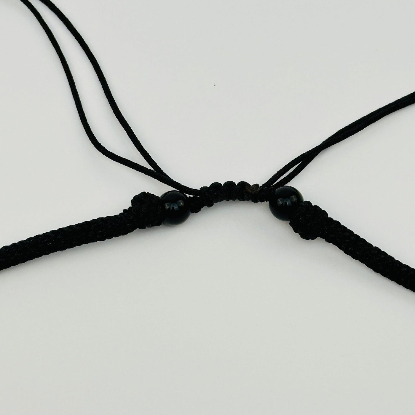 close up of the necklace where it is adjustable from 18-14"