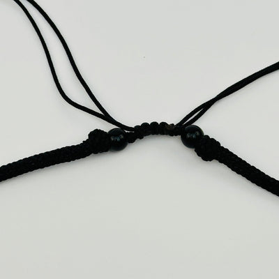 close up of the necklace where it is adjustable from 18-14"