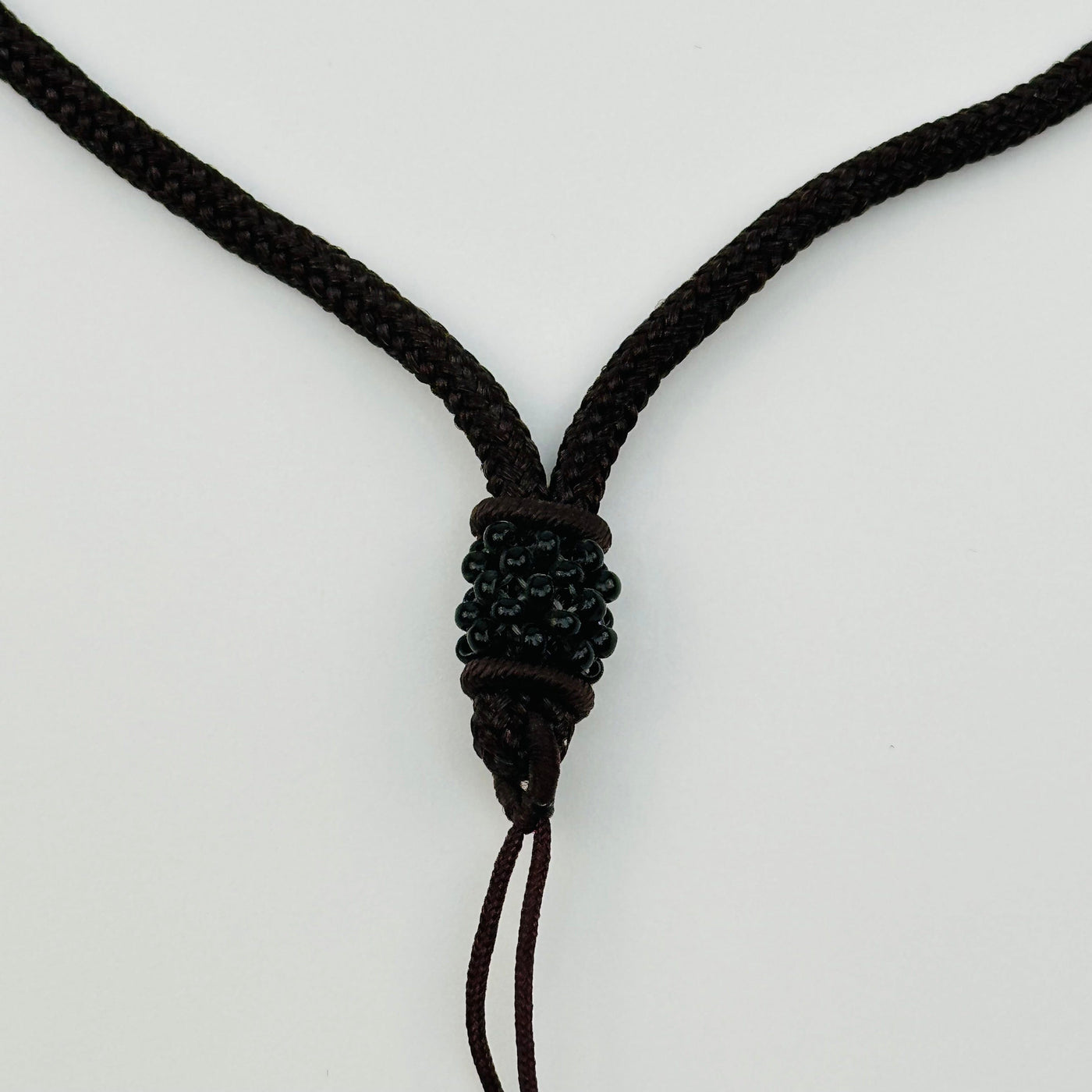 close up of the beaded details on the bottom of the necklace 