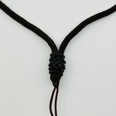 close up of the beaded details on the bottom of the necklace 