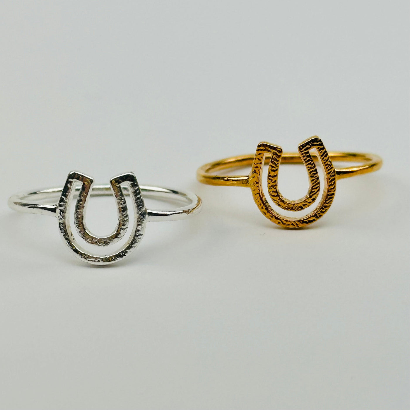 close up of the details on these horse shoe rings