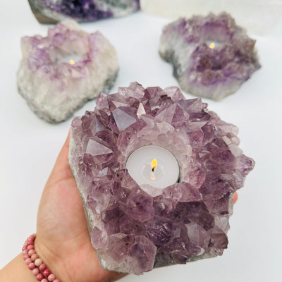 Amethyst Crystal Candle Holder in hand for size reference 