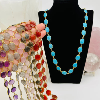 multiple necklaces on hand for size reference 