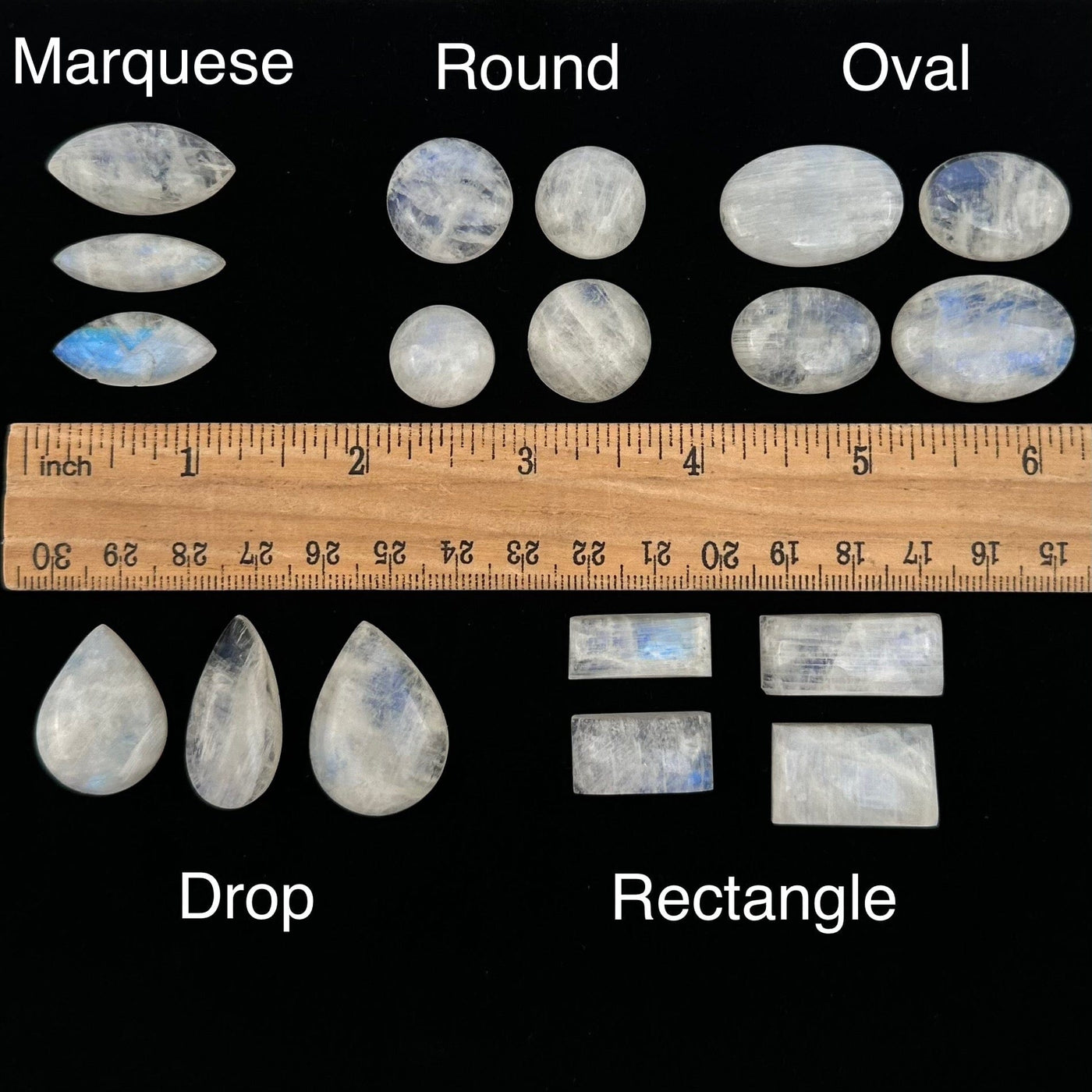 Moonstone Crystal Cabochons displayed next to a ruler for size reference 