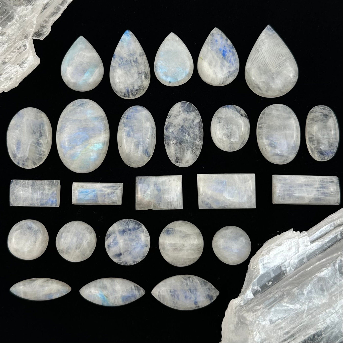 multiple Moonstone Crystal Cabochons displayed to show the differences in the shapes available 