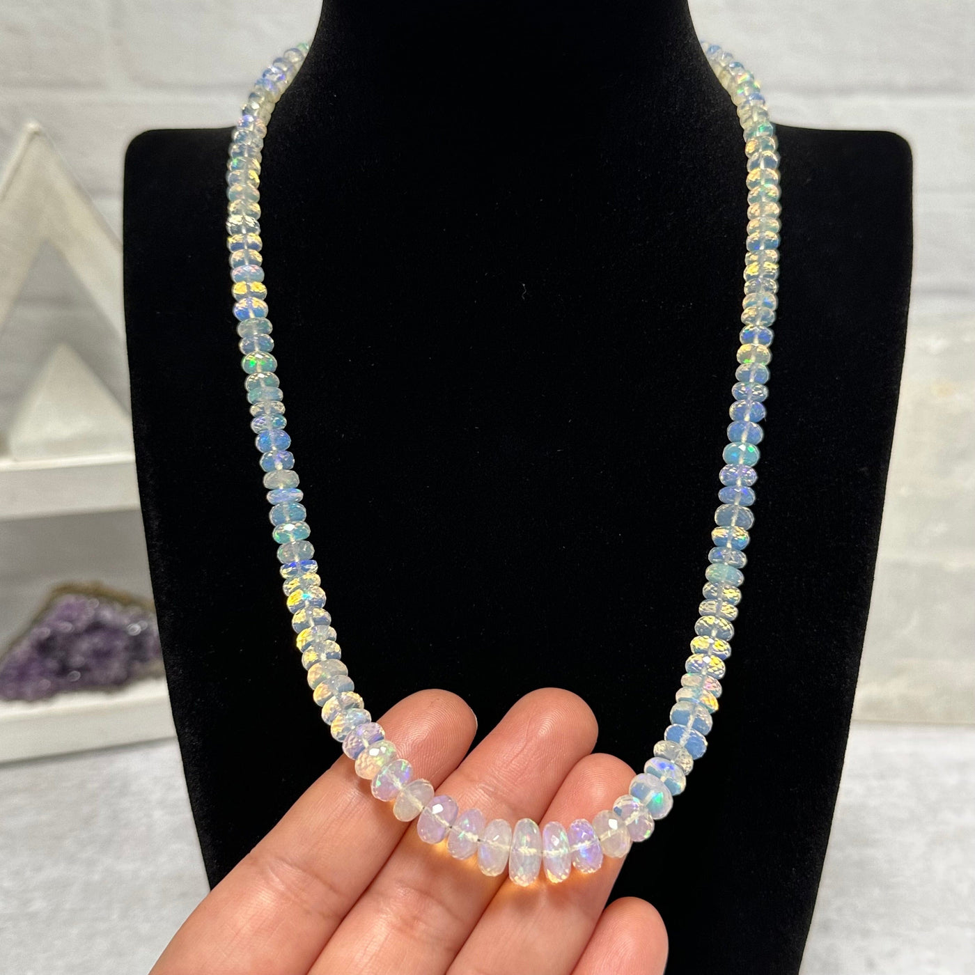Fancy Opal Necklace in hand for size reference 