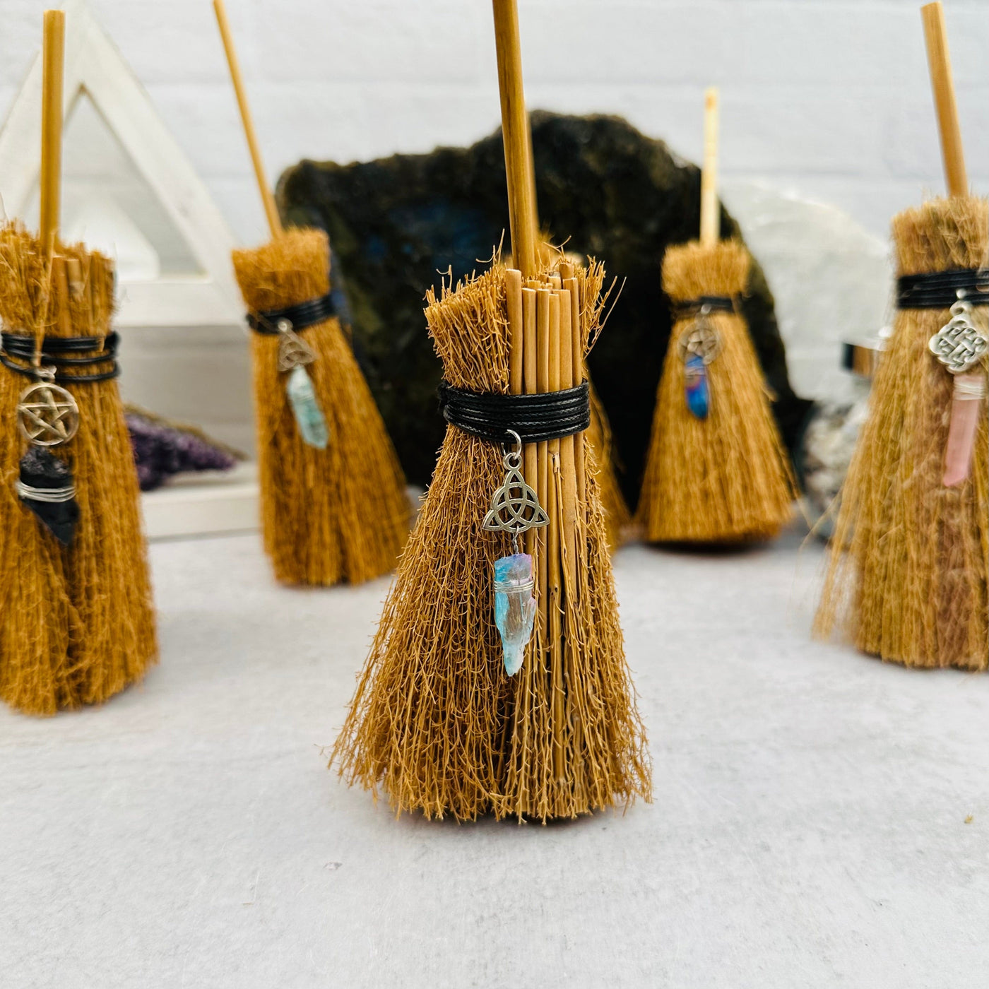 close up of the details on these brooms 